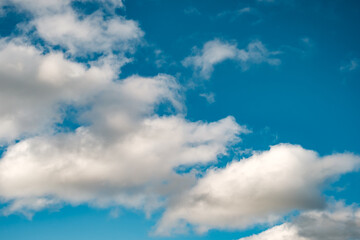 Blue sky background with a tiny clouds
