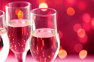 Close up photo of Champagne glasses against bokeh background