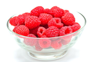 Ripe raspberries on a white background
