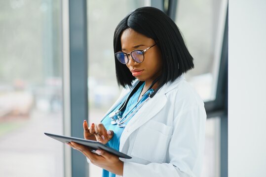 Beautiful African American Female Pediatric Nurse In Modern Office