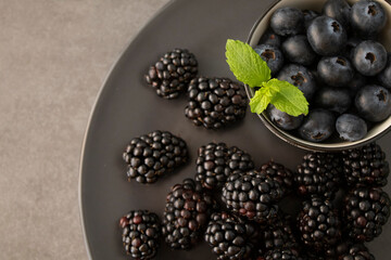 blackberries and blueberries on a plate