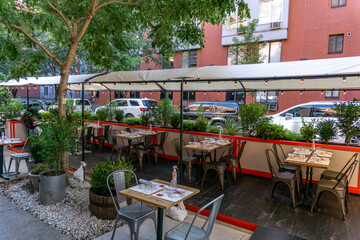 New York / USA - October 3 2020: An empty outdoor restaurant in downtown Manhattan. Covid outdoor...