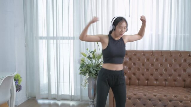 Exercise concept. Asian woman doing home aerobics. 4k Resolution.