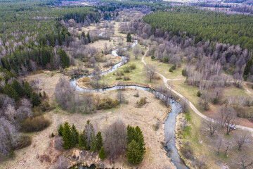 Fototapeta na wymiar Drone shot flying on spring river in forest