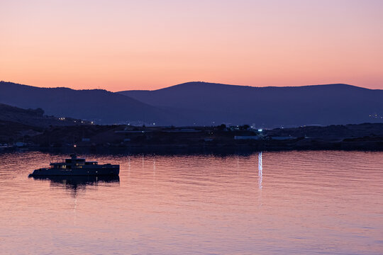 Nature background with sea and mountanes landscape at sunset or sunrise with red oringe colours