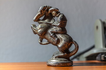 Metal figurine horse and rider