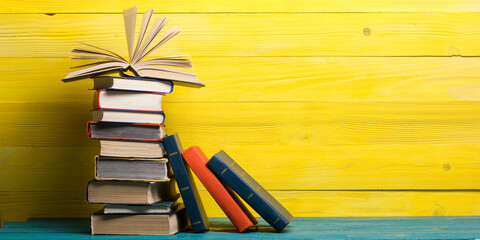 Books on wooden desk table and abstract background. Education background. Copy Space. Back to school.