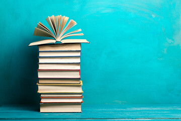 Books on wooden desk table and abstract background. Education background. Copy Space. Back to...