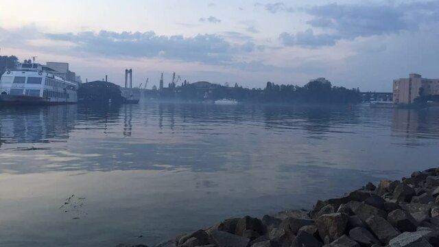 Foggy Morning Over City River with Docked Cruise Ships