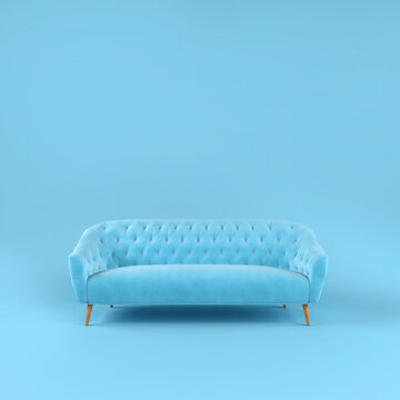 Stylish blue fabric sofa with wooden legs on blue background with shadow. Fashionable comfortable single piece of furniture. Blue interior, showroom. Vilyura, velvet sofa. Luxury couch front view