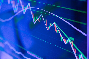 Closeup Display of Stock market quotes with city scene reflect on glass of LED, stock market graph on the screen, Business, finance or investment background concept