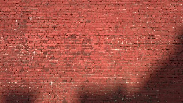 Large old rough and dirty brick wall close up. Camera moving up parallel to the wall.