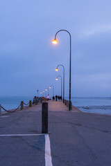 Obraz premium Night view of Pier La Fenetre and port of La Houle in Cancale, Brittany, France