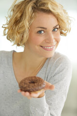 a happy woman with donut