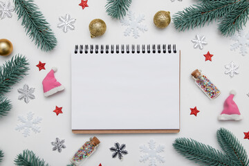 Fototapeta na wymiar New year christmas flat lay with empty notebook copy space, stars, snowflakes and festive decor on white background