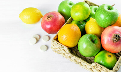 Tropical citrus fruits, multivitamins on the white background. Healthy fruits for boost immune system, antivirus remedy.