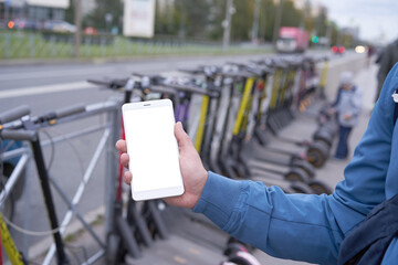 Fototapeta premium Mobile app for electric scooter rental, scooter Parking, as a business