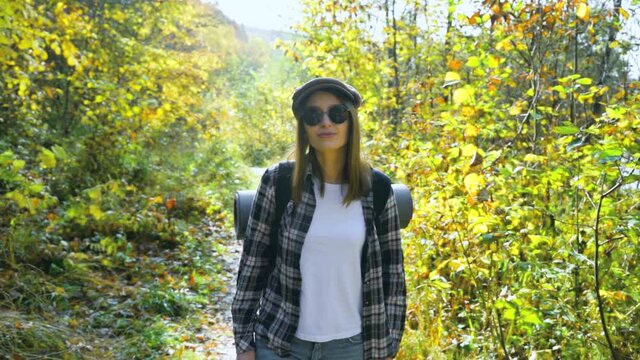 Girl on a hike in the mountains. Slow motion video