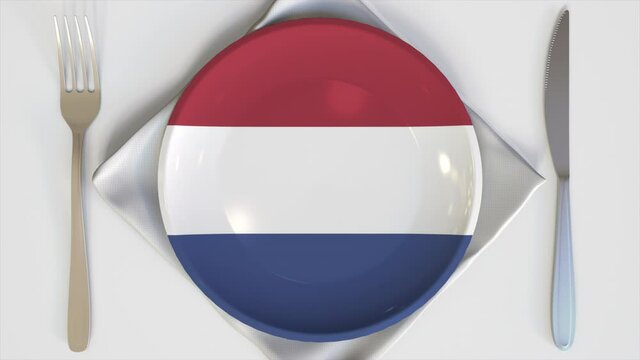 Top-down view of the plate with flag of the Netherlands, national cuisine conceptual animation