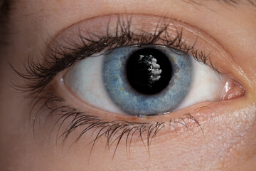blue female eye with reflection
