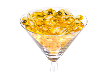 Transparent glass vessel with fish oil orange yellow softgels capsules fish oil omega 3 or omega 6,...