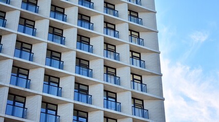 Estate property and condo architecture. Fragment of modern residential flat with apartment building exterior. Detail of new luxury home complex. 