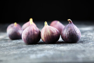 Fresh figs. Food Photo. whole and sliced figs on rustic background.