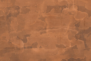 Vintage and old looking paper background. Colored orange with a brown retro book cover. Ancient book page.