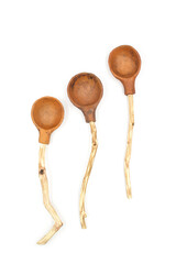 Photo of a ceramic teaspoon with a wooden handle made of twigs