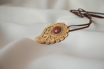 Naklejka premium amulet made of birch bark with amber