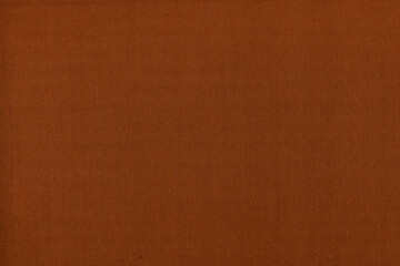 Vintage and old looking paper background. Colored orange with a brown retro book cover. Ancient book page.