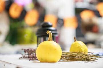 small decorative pumpkin and black lantern on table in Halloween. Making a party on all saints' day