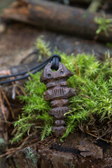 wooden amulet around the neck