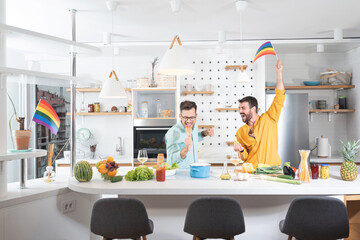 Gay men singing in kitchen