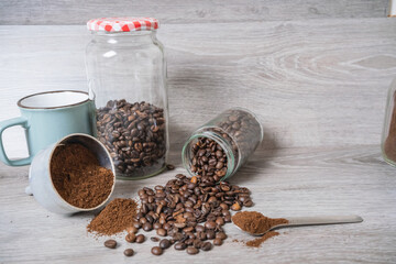 a cup on the table with coffee beans