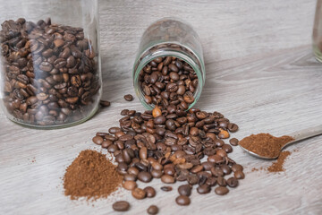 a cup on the table with coffee beans