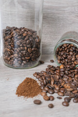 a cup on the table with coffee beans
