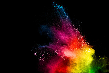 Abstract colorful powder explosion on black background.Freeze motion of dust splash.Painted Holi.