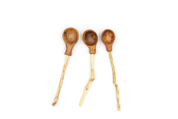 Photo of a ceramic teaspoon with a wooden handle made of twigs