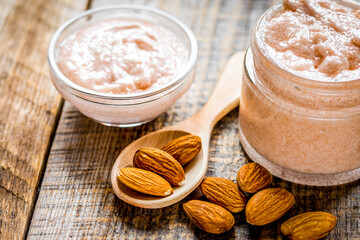 natural scrub with almond on wooden table background