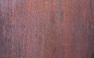 rusty metal background...

Rusty metal background of dark brown color with signs of corrosion, close-up side view.