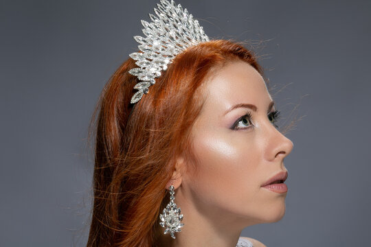 Woman With Diamond Crown Looking Up Posing