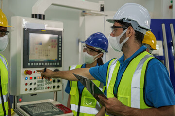 factory workers and technician having working brief from foreman