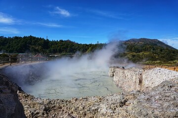 Photography of Sikidang crater, with a background of marble vapor that comes out of the bowels of the earth. Dieng. Wonosobo