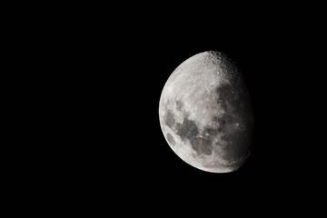 Two thirds of the moon on black background