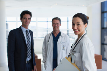 Fototapeta premium Portrait confident doctors and hospital administrator in lobby