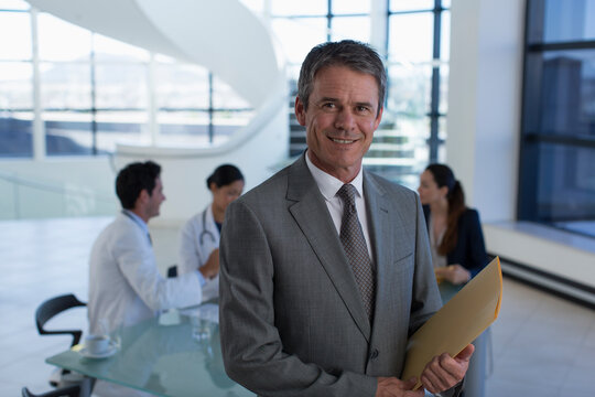 Portrait confident male hospital administrator in meeting