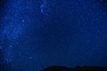Fototapeta na wymiar Stargazing at Mauna Kea Big island, Hawaii. Starry night sky, Milky Way galaxy astrophotography.