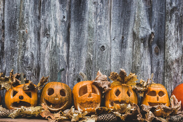 collection of autumn pumpkins for halloween in a row with different faces  banner design