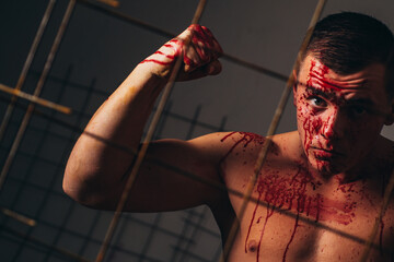 Murderer brutal aggressive guy. Halloween concept. Aggressive person. Injured soldier. Pain and...